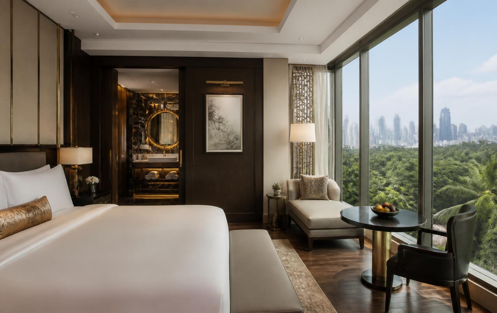 Luxury hotel suite overlooking greenery and the São Paulo skyline